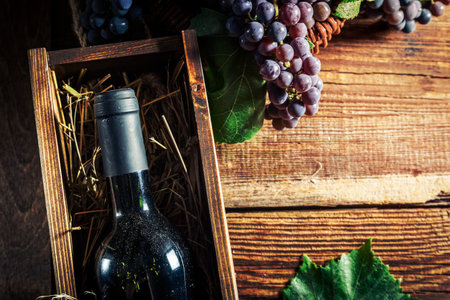 Tasty red wine in wooden boxの写真素材