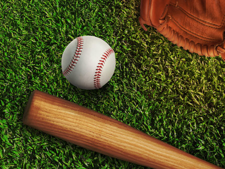 baseball, glove, ball and bat on field