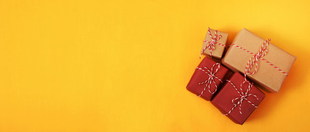 gift box brown new year yellow backgroundの写真素材