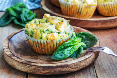 Freshly baked snack muffins with spinach and feta cheeseの写真素材