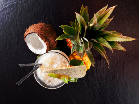 Fresh summer cocktail with exotic fruit, shot from upper view