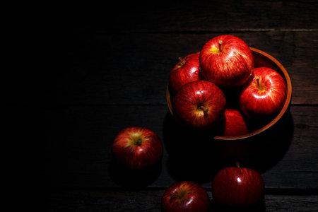 Fresh red apples on wooden background