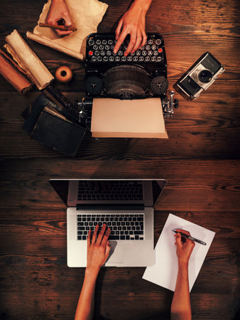 Old typewriter with laptop, concept of technology progressの写真素材