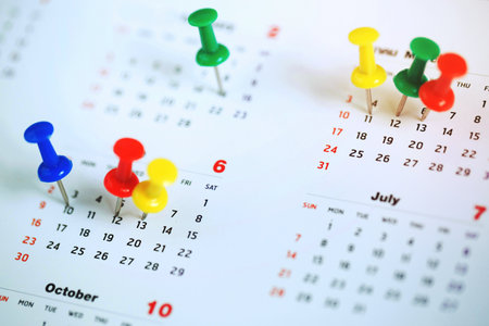 mark the event day with a pin. Thumbtack in calendar concept for busy timeline organize...