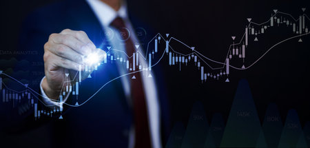Businessman touchscreen line of Stock market or forex trading graph and candlestick chart suitable...