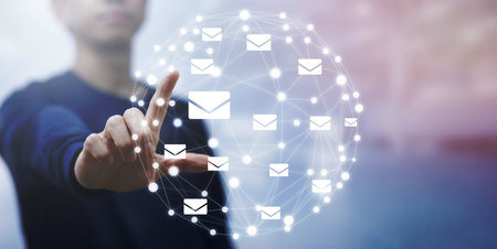 Man hand touch virtual world line with communication icons, letter icon, email icons, and newsletter...