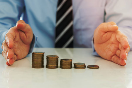 Businessman hands protecting the money. finance concept.の写真素材