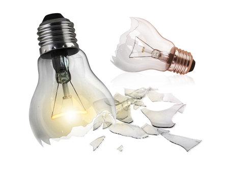 Broken light bulb isolated on white background