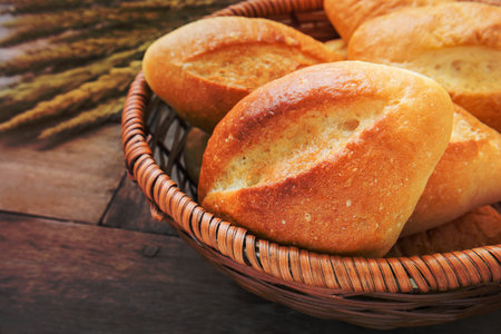 Baguette or bread in wicker basketの写真素材