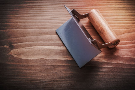former with wooden handle on wood board.の写真素材