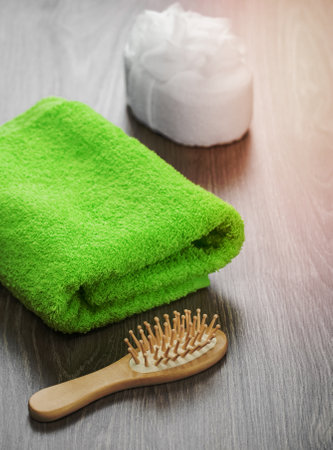 hairbrush and bath sponge with towelの写真素材