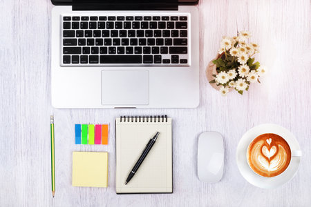 Top view laptop and workspace office on white tableの写真素材