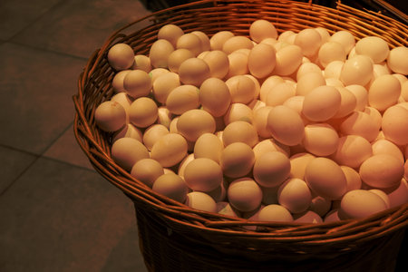 Big wicker basket with eggs in supermarket