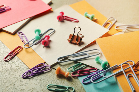 Concept of different office accessories - paper with clipの写真素材