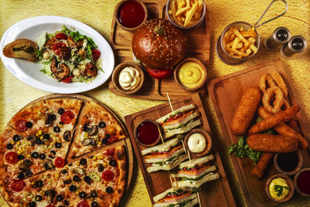 top view fast food mix mozzarella sticks club sandwich hamburger mushroom pizza caesar shrimp salad...