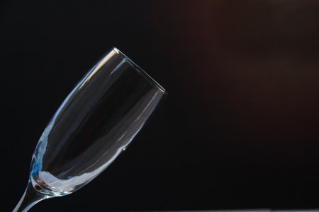 Pour water into the glass on a black background.の写真素材