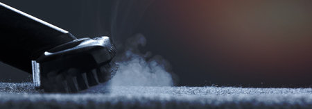 Horizontal shot of steam close-up. Steam carpet cleaning on a grey background. Photo from copy space.の写真素材