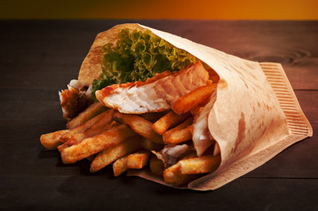 fish and chips in paper bagの写真素材
