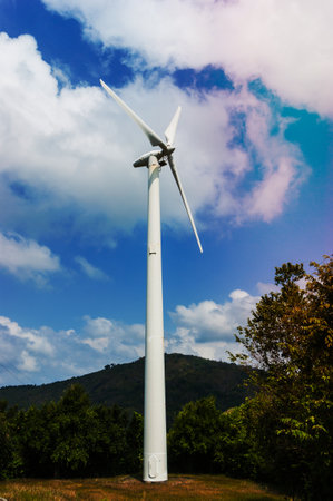 Wind mill power plant against blue sky