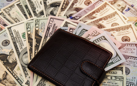Wallet with money as backgroundの写真素材