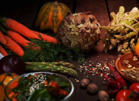 ripe vegetables salad and spices on a wooden tableの写真素材