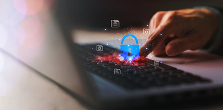 System hacked warning alert with master key on laptop (notebook). Cyber online fraud attack on...