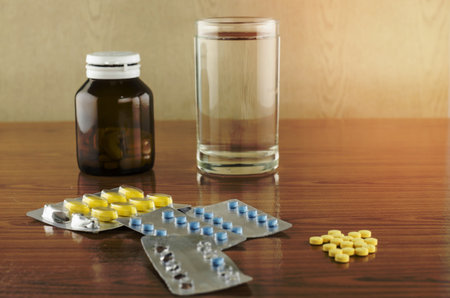 many pills to eat with water drinking concept time to take care your selfの写真素材