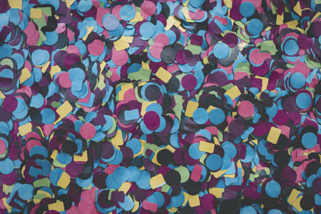 A photo of numerous confetti pieces of varying shapes and sizes