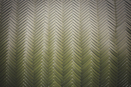 A close-up photograph of a green woven basket patternの写真素材