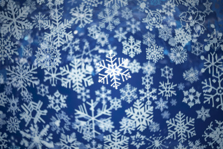 a vibrant blue background adorned with intricate white snowflake patternsの写真素材
