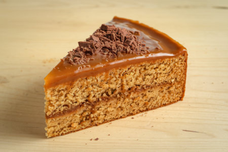 a slice of a cake with butterscotch glazeの写真素材