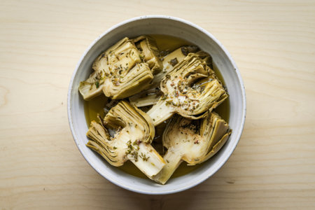 A photo of a bowl with a appetizer of artichoke heartsの写真素材