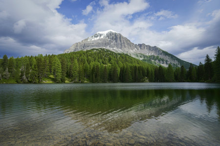 landscape photograph of a majestic snow-capped mountain peakの写真素材