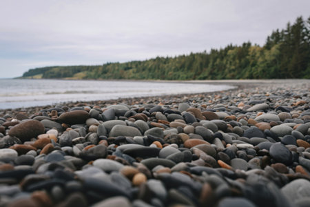 A serene beach scene with a  rounded pebbles