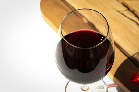 A photograph of a glass of deep red wineの写真素材