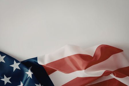 A close-up view of the American flag with its iconic red and white stripes and blue rectangle with...