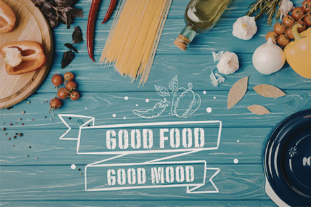 A blue wooden table with various food items and the phrase 'Good Food Good Mood'の写真素材