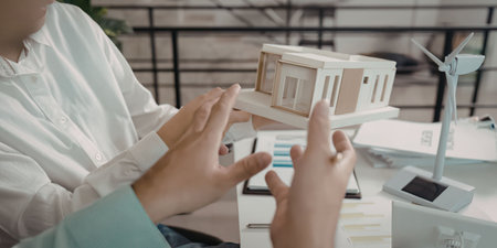 A person holding a model houseの写真素材