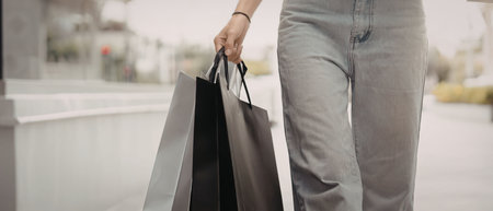 A person holding shopping bagsの写真素材