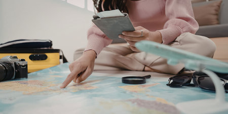 A young girl planning her next travel adventureの写真素材