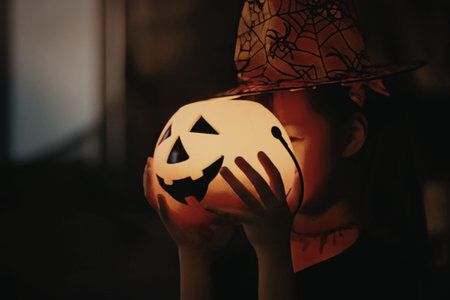 A spooky halloween scene with a glowing pumpkin