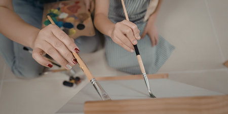 Artist creates beautiful painting with brushの写真素材