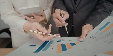 Business people analyzing data chartの写真素材