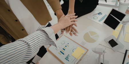 Business team stacking hands for motivationの写真素材