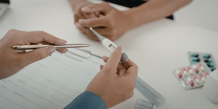 Doctor prescribing medication to patient