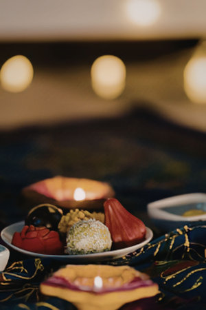 Diwali decorations with candles and sweets
