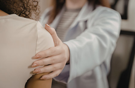 Doctor providing comforting support to patient
