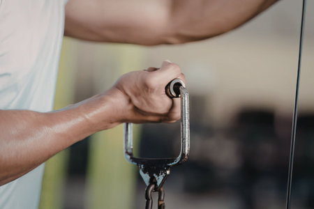 Man exercising with cable machine