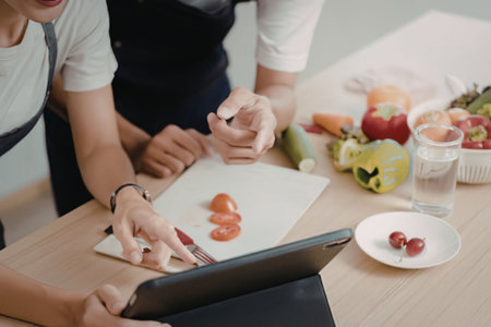 People preparing food in the kitchenの写真素材