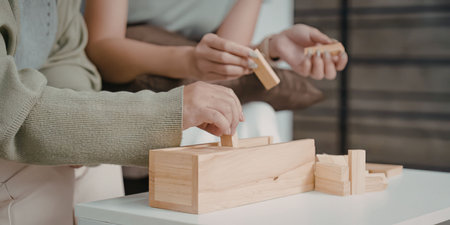 People building with wooden blocksの写真素材
